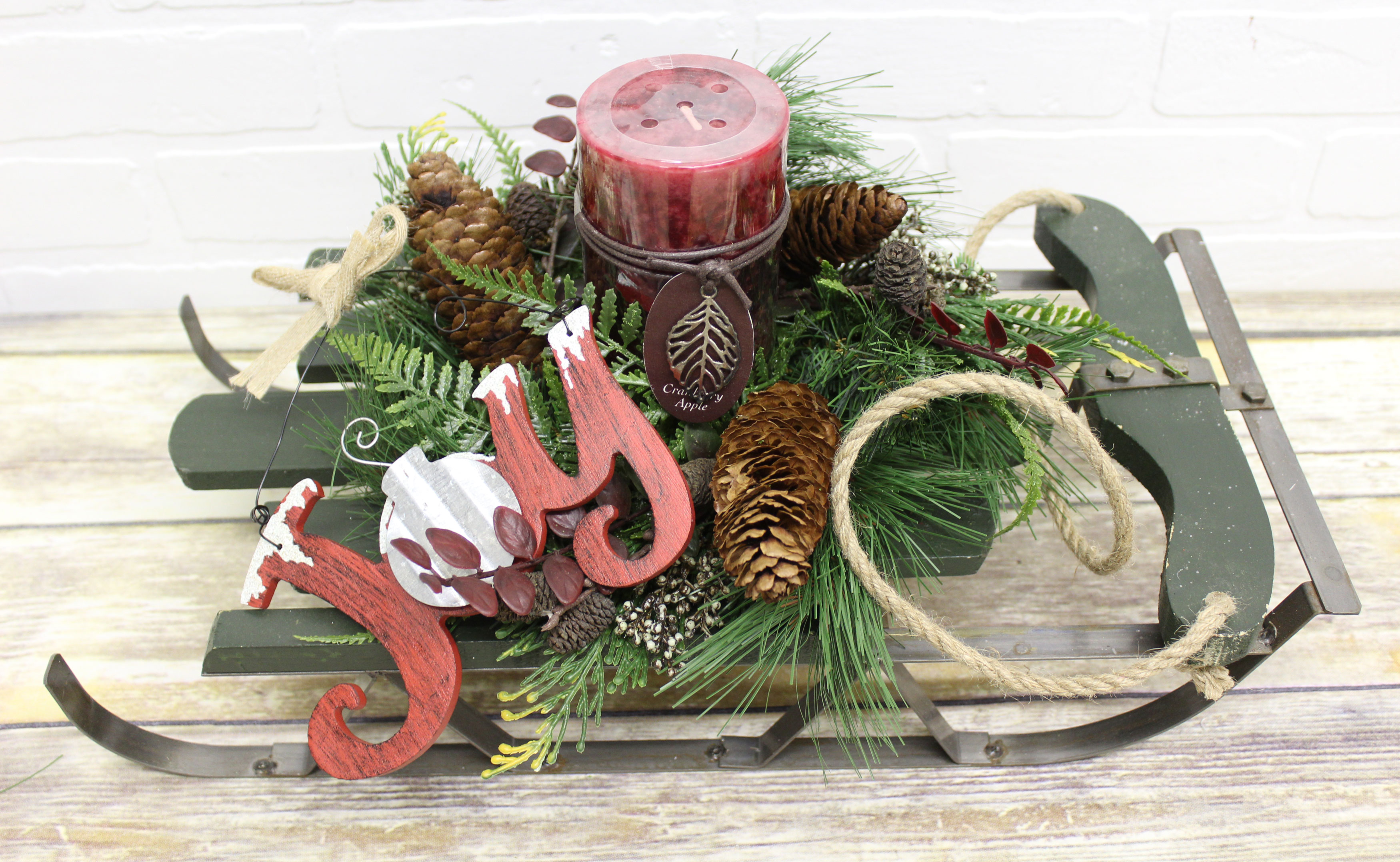 Holiday arrangement on sled Holiday arrangement on sled